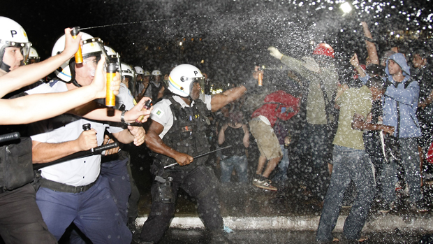 Police spray demonstrators with pepper gas during a student protest at National Congress in Brasilia, on June 20, 2013 within what is now called the &#039;Tropical Spring&#039; against corruption and p