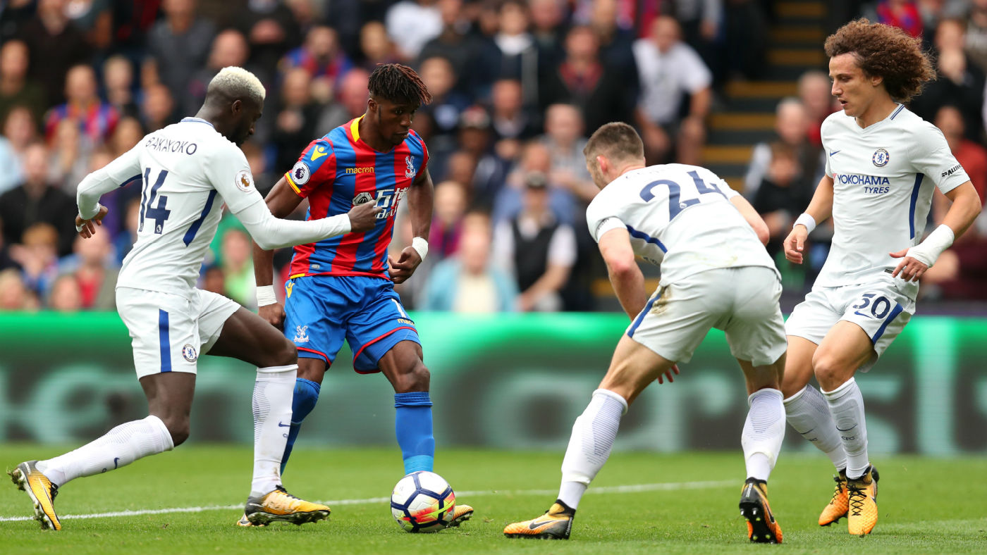 Crystal Palace forward Wilfried Zaha in action against Chelsea in the Premier League