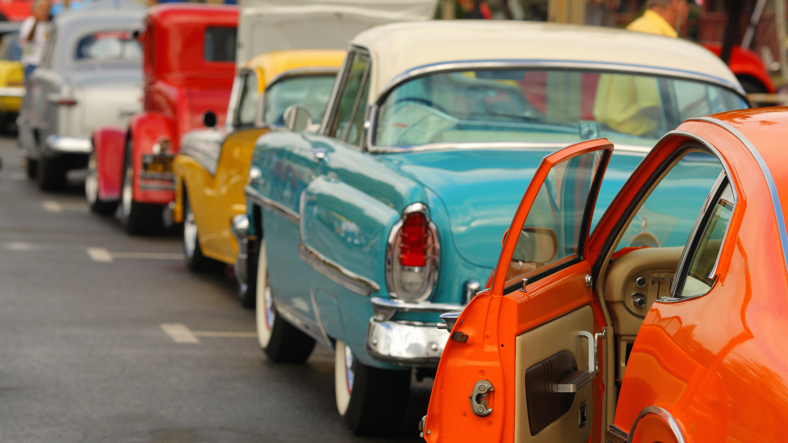 A row of parked vintage cars