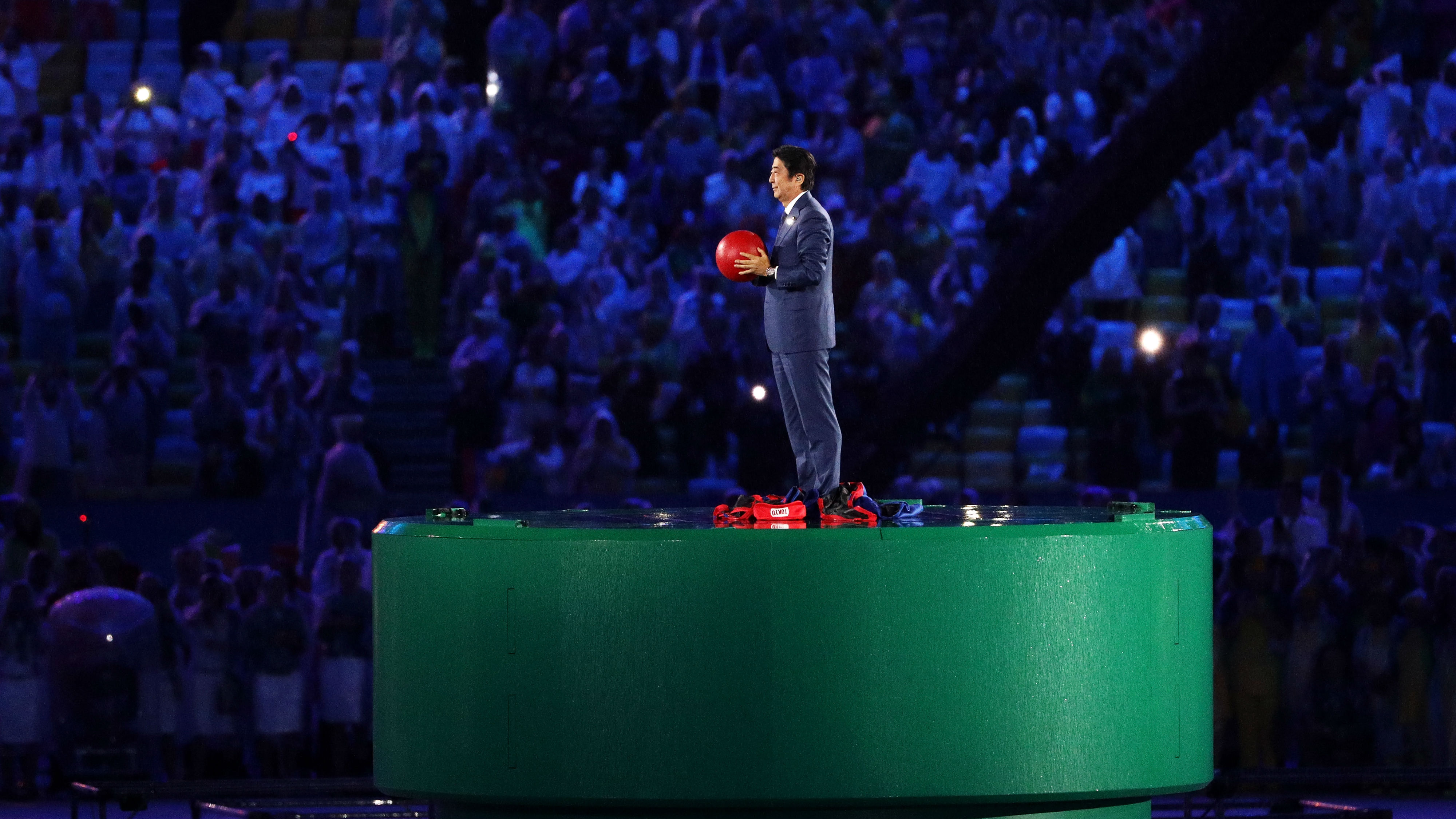 Japanese Prime Minister Shinzo Abe appears in Rio as the Olympic baton is passed on for 2020 