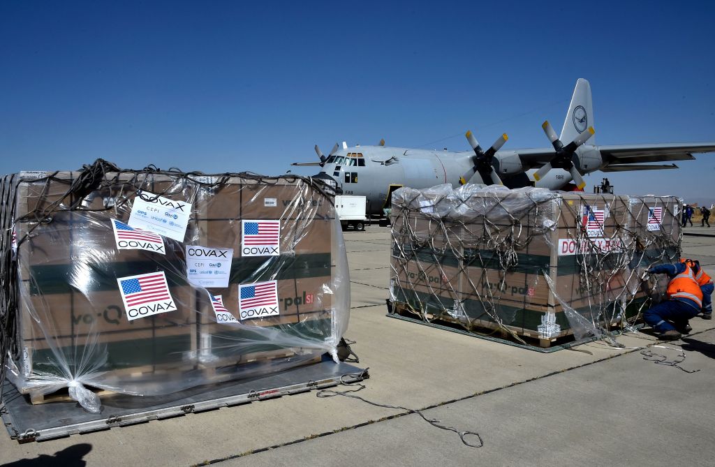 Shipment of Covid vaccines donated through Covax arrives at Bolivian Air Force base in El Alto