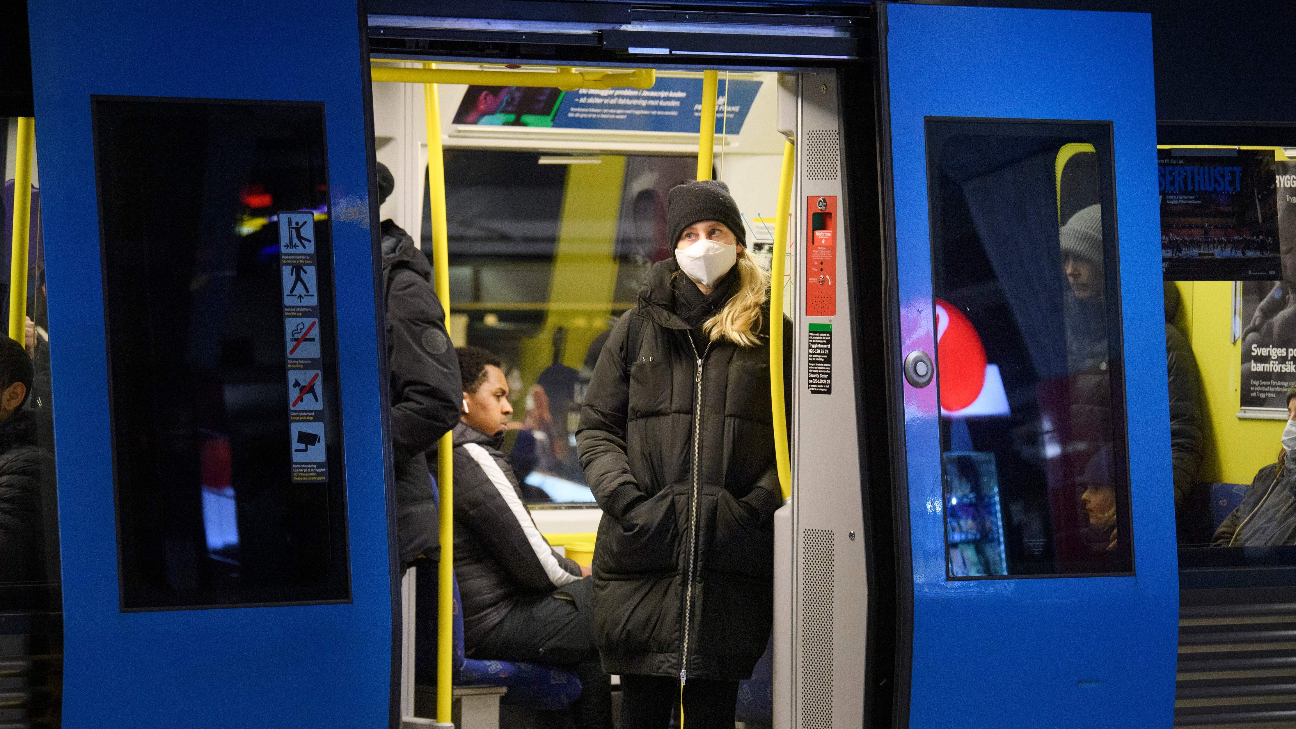 A passenger wearing a face mask on a subway train in Stockholm
