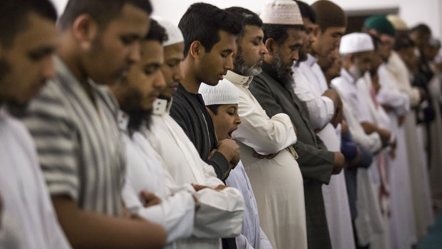 Muslim men pray during Ramadan in London