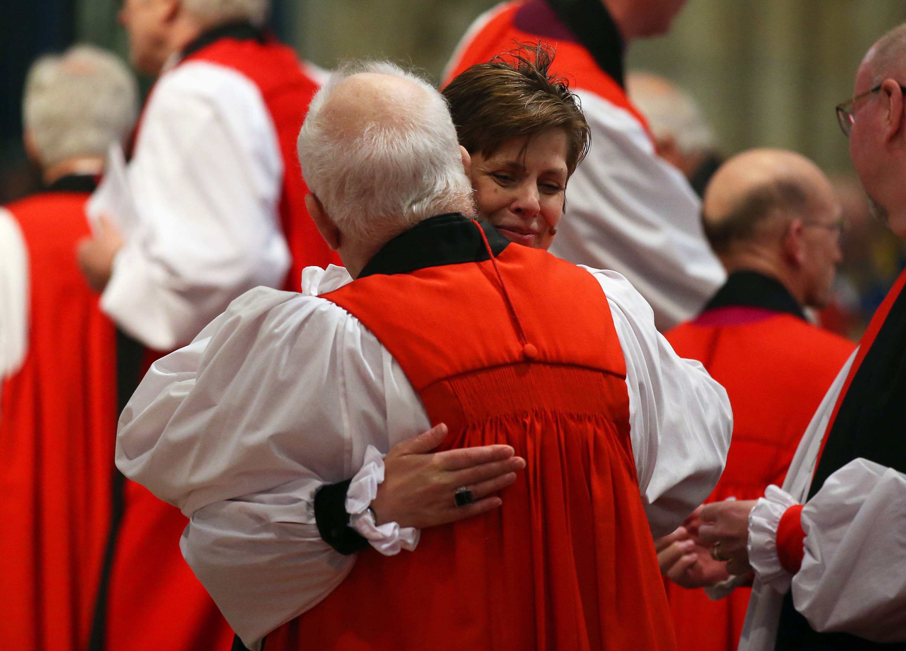 YORK, ENGLAND - JANUARY 26: The Reverend Libby Lane hugs a member of the clergy during a service in which she is consecrated as the eighth Bishop of Stockport at York Minster on January 26, 2